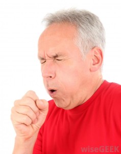 man-coughing-in-red-shirt